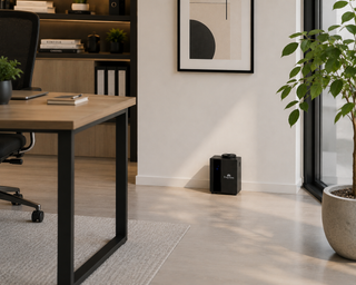 Black Verona Mini diffuser on a desk in a home office, lifestyle view