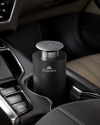 Black Mini Pro diffuser placed in a car cup holder, lifestyle view